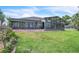 Large screened-in lanai with ample natural light, perfect for enjoying the outdoors while staying protected at 9950 W Lake Marion Rd, Haines City, FL 33844