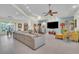 Bright living room featuring tile floors, neutral color palette, comfortable seating, and an open layout at 9950 W Lake Marion Rd, Haines City, FL 33844