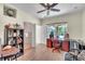 Office featuring a desk, shelving, a view to the ensuite bath, and laminate flooring at 9950 W Lake Marion Rd, Haines City, FL 33844