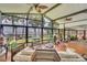 Sunroom boasting lots of natural light, lake views and space for relaxing at 9950 W Lake Marion Rd, Haines City, FL 33844