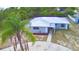 An aerial view of a charming single-story home with a metal roof and mature landscaping at 101 Babson Heights Dr, Babson Park, FL 33827