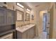 Bathroom featuring a double sink vanity with modern fixtures, neutral color scheme, and storage cabinet at 101 Babson Heights Dr, Babson Park, FL 33827