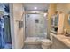 Updated bathroom showcasing a glass-enclosed shower with gray tile and a built in shower seat at 101 Babson Heights Dr, Babson Park, FL 33827