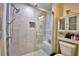 Bathroom showcasing a glass-enclosed shower with grey tile and a built in shower seat at 101 Babson Heights Dr, Babson Park, FL 33827