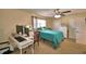 Bedroom with a desk, ceiling fan, and a window provides a comfortable work and rest space at 101 Babson Heights Dr, Babson Park, FL 33827
