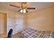 Bedroom features a ceiling fan, carpet flooring and ample natural light at 101 Babson Heights Dr, Babson Park, FL 33827