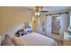 Bedroom features a sliding barn door leading to a shower and a make up vanity at 101 Babson Heights Dr, Babson Park, FL 33827