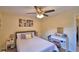 Cozy bedroom features soothing decor, a ceiling fan, and a comfortable queen-sized bed at 101 Babson Heights Dr, Babson Park, FL 33827