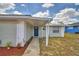 Charming single-story home with a metal roof, freshly painted exterior and landscaped front yard at 101 Babson Heights Dr, Babson Park, FL 33827