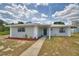 Charming single-story home with a metal roof, freshly painted exterior and landscaped front yard at 101 Babson Heights Dr, Babson Park, FL 33827