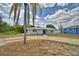 Charming single-story home with a metal roof, freshly painted exterior and a circular driveway at 101 Babson Heights Dr, Babson Park, FL 33827