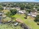 Aerial shot of the property showing lake access, docks, and residential neighborhood at 1010 Biltmore Nw Dr, Winter Haven, FL 33881