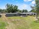 Aerial view of house with a large backyard and screened-in porch at 1010 Biltmore Nw Dr, Winter Haven, FL 33881