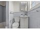 Quaint bathroom with neutral-toned tile and fixtures at 1010 Biltmore Nw Dr, Winter Haven, FL 33881