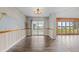 Dining area with water view, muraled wall, and wood-look flooring at 1010 Biltmore Nw Dr, Winter Haven, FL 33881