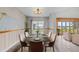 Elegant dining room with mural art, modern lighting, and a view of the lake at 1010 Biltmore Nw Dr, Winter Haven, FL 33881