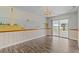 Elegant dining room with mural art, modern lighting, and a view of the lake at 1010 Biltmore Nw Dr, Winter Haven, FL 33881