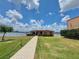 Lakeside business with well-maintained green space and a charming brick walkway at 1010 Biltmore Nw Dr, Winter Haven, FL 33881