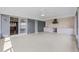 Covered patio with outdoor kitchen and doors that open to the interior at 1010 Biltmore Nw Dr, Winter Haven, FL 33881