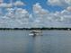 Seaplane taking off from the lake under a beautiful sky at 1010 Biltmore Nw Dr, Winter Haven, FL 33881