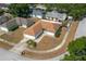 Aerial view of a single-story home in a residential neighborhood at 1055 Sunshine Sw Way, Winter Haven, FL 33880