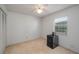 Bedroom features window, closet, and ceiling fan at 1055 Sunshine Sw Way, Winter Haven, FL 33880
