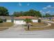 Charming single-story home with a well-maintained lawn and a two-car garage at 1055 Sunshine Sw Way, Winter Haven, FL 33880