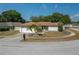 Charming single-story home with a well-maintained lawn and a two-car garage at 1055 Sunshine Sw Way, Winter Haven, FL 33880