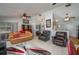 Bright living room with neutral walls, tile floors and comfortable seating at 1055 Sunshine Sw Way, Winter Haven, FL 33880