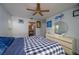 The main bedroom offers a ceiling fan and ample dresser storage at 1055 Sunshine Sw Way, Winter Haven, FL 33880