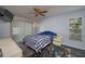Bedroom features ceiling fan, and sliding doors to the lanai for lots of natural light at 1055 Sunshine Sw Way, Winter Haven, FL 33880