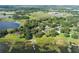 Beautiful aerial shot showcasing a community with a dock and lake access, surrounded by lush greenery at 1163 Lake Dr, Lake Wales, FL 33859