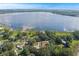 Beautiful aerial shot showcasing a property with a lake view and a red line marking the property's boundary at 1163 Lake Dr, Lake Wales, FL 33859