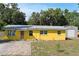 Lovely single-Gathering home with colorful exterior, well-manicured lawn, and private driveway at 1163 Lake Dr, Lake Wales, FL 33859