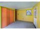 Garage with bi-fold doors, window, and door at 1163 Lake Dr, Lake Wales, FL 33859