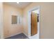 Hallway with door to bathroom, carpet, and mirror on the wall at 1163 Lake Dr, Lake Wales, FL 33859