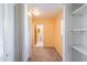 Hallway leads to a bathroom, and has a closet and shelves at 1163 Lake Dr, Lake Wales, FL 33859