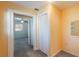 Hallway with carpet, closet, and a doorway to a bedroom with a ceiling fan at 1163 Lake Dr, Lake Wales, FL 33859