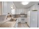 Bright kitchen featuring white cabinetry, granite countertops, and stainless steel appliances at 1163 Lake Dr, Lake Wales, FL 33859