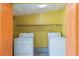 Laundry room with two washing machines and a shelf at 1163 Lake Dr, Lake Wales, FL 33859
