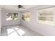 Sunroom with tile floors, natural light, and a view of the surrounding landscape at 1163 Lake Dr, Lake Wales, FL 33859