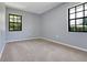 Clean bedroom with two windows allowing for an abundance of natural light at 1226 Lake Loop, Winter Haven, FL 33880