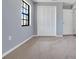 Bedroom features plush carpeting, window, and closet with bi-fold doors at 1226 Lake Loop, Winter Haven, FL 33880