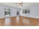 Bedroom with neutral walls, wood-look floors, and large windows overlooking the yard at 1226 Lake Loop, Winter Haven, FL 33880