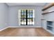Home office with built-in shelves and large window offering natural light and outdoor views at 1226 Lake Loop, Winter Haven, FL 33880