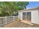View of back deck and the sliding door into the home at 1294 1/2 38Th Nw St, Winter Haven, FL 33881