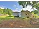 View of back side of home, deck, and backyard at 1294 1/2 38Th Nw St, Winter Haven, FL 33881