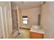 Bathroom featuring tile flooring, toilet, vanity, and shower stall at 1294 1/2 38Th Nw St, Winter Haven, FL 33881