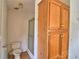 Bathroom showcasing a toilet, shower, and vanity cabinet, all harmoniously arranged for optimal space utilization at 1294 1/2 38Th Nw St, Winter Haven, FL 33881