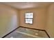 A bedroom with one window and tile floor at 1294 1/2 38Th Nw St, Winter Haven, FL 33881